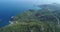 Hill Seaside Landscape Ocean Water Aerial View. Rocky Isle Scenery Road Go through Greenery Wood