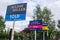 HILLINGDON, LONDON, ENGLAND - 14 August 2021: Sold signs outside block of flats in London