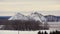 Hills covered with snow. Camera: right to left. Winter landscape.