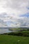 Hills with green fields and sheeps along Antrim Coast