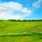 Hills, green grass and blue sky