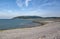 Hills rise rise up behind the stoney beach at Porlock Weir in Somerset, UK