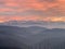 Hills surrounding Uetliberg at sunset in winter with Alps on the horizon, district Zurich Switzerland
