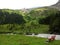 Hillside bench in alpine mountain valley summer season landscape