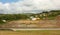 A hillside in the caribbean cut to accommodate a runway