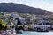 Hillside homes of Queenstown Otago New Zealand rising from the shore of Lake Wakatipu