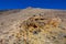 Hillside of huge volcano with yellow sulfurous rocks