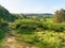 On a hillside looking out over the fields and woodlands of Derbyshire