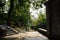 Hillside stone path and stairway before tile-roofed buildings in