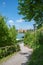 Hillside walkway with view to lake tegernsee and castle