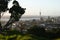 Hilltop vista of coastal cityscape of cbd and Sky Tower from Mount Eden with lush vegetation before sunset, Auckland, New Zealand