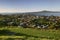 Hilltop vista of seaside suburb, scenic coast and Rangitoto Island from grassy Mount Victoria, Devonport, Auckland, New Zealand