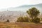 Hilly area covered with light haze. Morning landscape in mountains