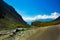 Hilly highway with green pasture and blue sky on the way to himalaya from the road,manali tourism Himachal leh ladakh, India