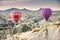 Hilly landscape and balloon. Balloons. Goreme, Cappadocia - Landmark attraction in Turkey