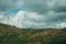 Hilly landscape and several wind generators of electric power