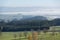 Hilly panorama with fog ceilings