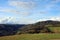 Hilly panorama with meadows and rolling hills on a sunny day