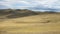 Hilly Steppe landscape, blue sky with clouds. in Siberian