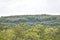 A Hilly View With Forest Trees