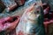 Hilsa fish being cut for cooking