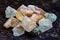 Himalayan lamp white and pink salt crystals for therapy on wooden background.