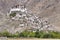 Himalayan mountains and Chemrey gompa, Buddhist monastery in Ladakh, India