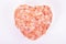 Himalayan Pink Salt in bowl ceramic heart shape. Health concept.