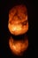 Himalayan rock salt lamp and reflection