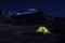 Himalayas, Nepal. A lonely tent at night in the middle of mountain peaks