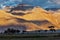 HImalayas on sunset with tree silhouettes.