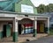 The Himeville mini mall with mailboxes painted in the colours of the South African flag.