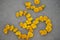 Hindi alphabet letter of Hindu holy Om written with yellow marigold flowers
