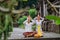 hindu couple put their hand on top of their head doing the prayer at pura