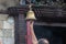 Hindu Devotee ringing temple bells in the Temple