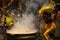 Hindu devotees perform the turmeric bathing ritual during the annual festival held at Amman temple