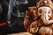 Hindu god Ganesh on a black background. Rudraksha statue and rosary on a wooden table with a red incense stick and incense smoke