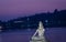 Hindu god lord shiva statue in meditation posture with dramatic sky at evening from unique angle