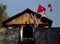 Hindu Goddess Chamunda Temple and wooden top with red religious flags