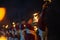 Hindu male priest performing river ganges aarti at rishikesh