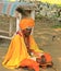 Hindu monk in traditional orange dress, village of India