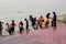 Hindu people bathing in the ghat near the Dakshineswar Kali Temple in Kolkata