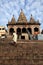 Hindu pilgrim climbs up the steps of a temple