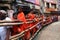 Hindu pilgrims wearing saffron dress stand in queue to visit the Kashi Viswanath temple