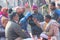 Hindu priest performing religious rituals at Ganges river bank in Varanasi, India