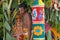 Hindu priest standing on decorated chariot during festival, Ahobilam, India