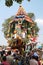 Hindu priests standing on decorated chariot during festival, Ahobilam, India