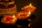 Hindu religion and Indian celebration of Diwali festival concept with diya lamps and candles around the Lord Ganesh. Ganesha is