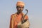 Hindu sadhu holy man and snake cobra in Pushkar, India, close up portrait