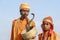 Hindu sadhu holy men and snake cobra in Pushkar, India, close up portrait